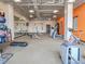 Community gym with exercise equipment, including weights, treadmills, and stationary bikes at 2436 Welton St, Denver, CO 80205