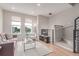 Bright living room with hardwood floors, modern lighting, and stairs leading to the upper level at 2436 Welton St, Denver, CO 80205