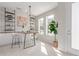 Bright office space features built-in shelves, stylish lighting, and natural light from large windows at 2436 Welton St, Denver, CO 80205