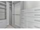 Custom walk-in closet with built-in shelving and drawers for optimal organization at 2436 Welton St, Denver, CO 80205
