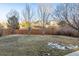 Large backyard with a wooden fence at 3914 S Perth St, Aurora, CO 80013