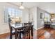 Bright dining area with wood floors and view from window at 3914 S Perth St, Aurora, CO 80013