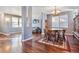 Bright dining room with hardwood floors and a view into the living room at 3914 S Perth St, Aurora, CO 80013