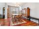 Dining area with hardwood floors, a round table, and wooden chairs at 3914 S Perth St, Aurora, CO 80013