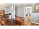 Dining room with hardwood floors and a view into the living room and office at 3914 S Perth St, Aurora, CO 80013