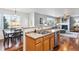 Open kitchen with island and breakfast bar at 3914 S Perth St, Aurora, CO 80013