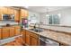 Kitchen with stainless steel appliances and wood cabinets at 3914 S Perth St, Aurora, CO 80013