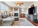 Living room boasting hardwood floors and a fireplace at 3914 S Perth St, Aurora, CO 80013