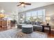 Living room open to kitchen with hardwood floors at 3914 S Perth St, Aurora, CO 80013