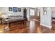 Living room features hardwood floors and a view into the dining area at 3914 S Perth St, Aurora, CO 80013