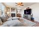 Living room with hardwood floors, fireplace, and large TV at 3914 S Perth St, Aurora, CO 80013