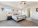 Main bedroom with vaulted ceiling and carpeted floor at 3914 S Perth St, Aurora, CO 80013