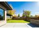 Private backyard with a grassy lawn and a modern fence at 1110 Elm St, Denver, CO 80220