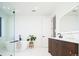 Bright bathroom featuring modern fixtures, a freestanding tub, and a glass-enclosed shower at 1110 Elm St, Denver, CO 80220