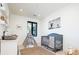 Charming Bedroom with gray crib, a teepee, and modern decor and natural light at 1110 Elm St, Denver, CO 80220