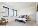 Spacious bedroom with a comfortable bed and sitting area at 1110 Elm St, Denver, CO 80220