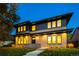 Beautiful two-story home with brick facade, dark trim, and professionally landscaped front yard at dusk at 1110 Elm St, Denver, CO 80220