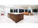 Contemporary kitchen island with white countertops and wooden cabinetry at 1110 Elm St, Denver, CO 80220