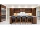 Modern kitchen features dark wood cabinets and a large kitchen island at 1110 Elm St, Denver, CO 80220