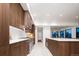 Spacious kitchen with modern cabinetry and large island at 1110 Elm St, Denver, CO 80220