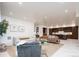 Open living room showcasing modern furniture and a view into the kitchen at 1110 Elm St, Denver, CO 80220