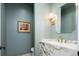 Stylish powder room with marble countertop and modern fixtures at 1110 Elm St, Denver, CO 80220