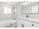 Elegant bathroom with a modern vanity, stylish mirror, and a tiled shower/tub combo at 3657 Krameria St, Denver, CO 80207