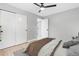 Bedroom featuring a ceiling fan, closet with sliding doors and neutral color scheme at 3657 Krameria St, Denver, CO 80207