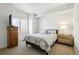 Second bedroom with a queen bed and neutral decor at 4520 Broadway St # 208, Boulder, CO 80304