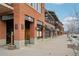 Brick commercial building with multiple storefronts and sidewalk at 4520 Broadway St # 208, Boulder, CO 80304