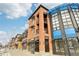 Brick building exterior, multiple storefronts and apartments at 4520 Broadway St # 208, Boulder, CO 80304
