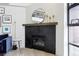 Modern fireplace with dark stone and wood mantel at 4520 Broadway St # 208, Boulder, CO 80304