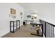 Modern home office loft features a glass desk, ample natural light, and built-in shelving at 4520 Broadway St # 208, Boulder, CO 80304