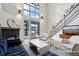 Spacious living room with floor to ceiling windows and fireplace at 4520 Broadway St # 208, Boulder, CO 80304
