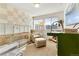 Cozy Bedroom with modern furnishings, a crib, chair, and ample natural light at 9628 Dunning Cir, Highlands Ranch, CO 80126