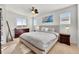 Bright bedroom with a ceiling fan, two windows and modern decor at 9628 Dunning Cir, Highlands Ranch, CO 80126