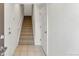 Inviting entryway with tiled floor, a staircase leading upstairs, and a coat closet at 9628 Dunning Cir, Highlands Ranch, CO 80126