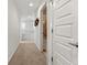 Bright hallway with neutral walls leading to several rooms in the home at 9628 Dunning Cir, Highlands Ranch, CO 80126