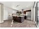 Bright and airy kitchen with a large island, modern appliances, and hardwood floors at 9628 Dunning Cir, Highlands Ranch, CO 80126