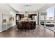 Modern kitchen featuring a central island with bar stools, stainless steel appliances, and an open layout at 9628 Dunning Cir, Highlands Ranch, CO 80126