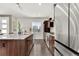 Well-lit kitchen with a granite island, stainless steel appliances, and ample cabinet space at 9628 Dunning Cir, Highlands Ranch, CO 80126