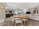 Open-concept living room with dining area, modern kitchen, and comfortable seating at 9628 Dunning Cir, Highlands Ranch, CO 80126