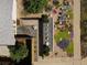 Aerial view of modern landscaping, rocks, and xeriscaped front yard at 2545 S Lowell Blvd, Denver, CO 80219