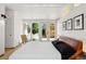 Modern bedroom with glass doors leading to the patio at 2545 S Lowell Blvd, Denver, CO 80219