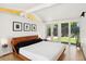 Modern bedroom with glass doors leading to the exterior at 2545 S Lowell Blvd, Denver, CO 80219