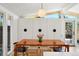 Bright dining room with sleek light fixture and exterior view at 2545 S Lowell Blvd, Denver, CO 80219