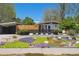 Beautifully landscaped front yard with modern fence and xeriscaping at 2545 S Lowell Blvd, Denver, CO 80219