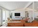 Bright and airy living room with modern decor and comfortable leather seating at 2545 S Lowell Blvd, Denver, CO 80219