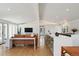 Open concept living space with a modern kitchen and comfortable seating area at 2545 S Lowell Blvd, Denver, CO 80219
