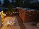Stylish patio featuring exterior lighting and wood accents at 2545 S Lowell Blvd, Denver, CO 80219